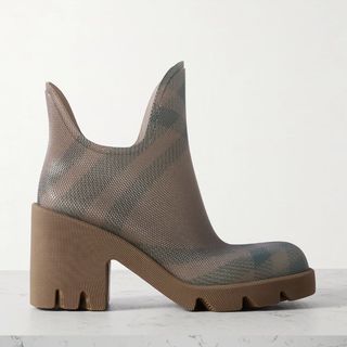 A cut out of a Burberry welly shoe sat on a table with a white background