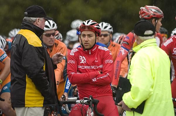 Tour Director John Craven (left) explains the situation to Drapac Porsche's Joseph Lewis who was just fourteen seconds off the lead; Conditions weren't ideal and Lewis heads overseas for racing straight after the tour.