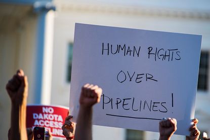 Protesters against the Dakota Access pipeline gather outside the White House on Tuesday.