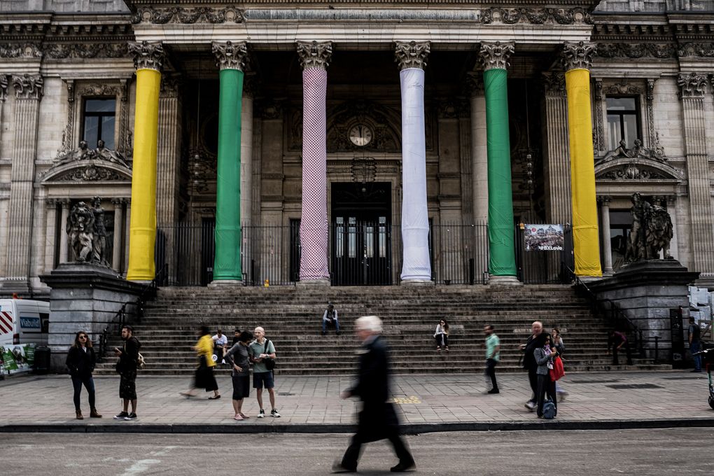 The Brussels stock exchange building Beurs-Bourse with its columns wrapped with the colours of the 2019 Tour de France jerseys
