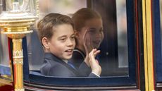 Prince George of Wales and Princess Charlotte of Wales wave during Trooping the Colour on June 15, 2024 in London, England