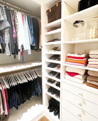 Closet with organizers and clothes folded up
