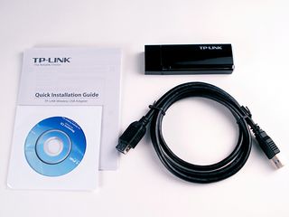 Figure 15 - The contents of the TP-Link Archer T4U Wi-Fi adapter. Note the mini CD for the software, and the USB extension cable.