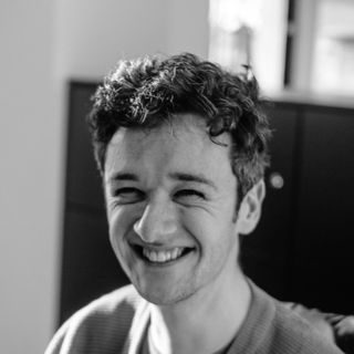 A headshot of Rory Bathgate, Features and Multimedia Editor at ITPro, shot in black and white and including his head and part of his shoulders.