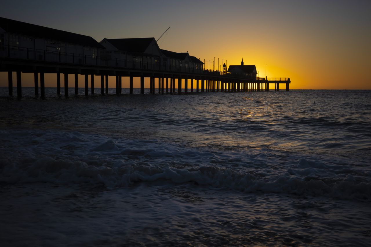 Sunrise over a British seaside pier