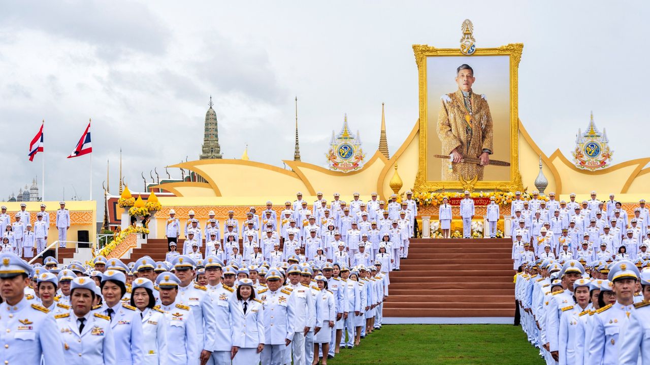 Government officials ranged in front of a portrait of King Maha Vajiralongkorn outside the Grand Palace in Bangkok during celebrations to mark his 72nd birthday in July