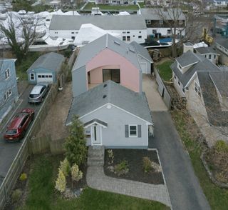 aerial view of House On House residence, an American suburban house with a twist