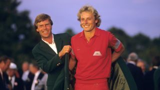 Ben Crenshaw hands Bernhard Langer the Green Jacket after his 1985 Masters title