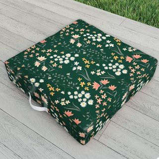 decorating for a garden party with outdoor floral print floor cushions