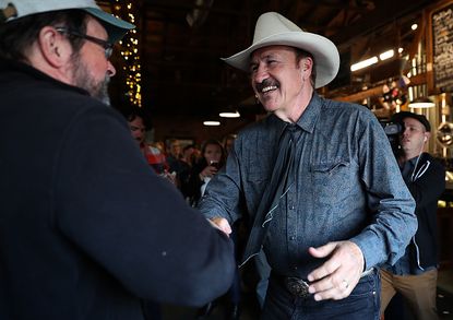 Rob Quist greets a supporter.