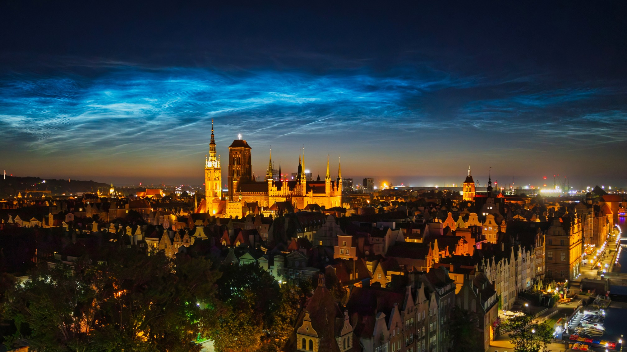 Noctilucent Clouds over the Gdansk Main Town at summer night, Poland.