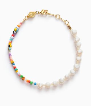 Necklace featuring one half pearl beads and the other half coloured, mismatched beads