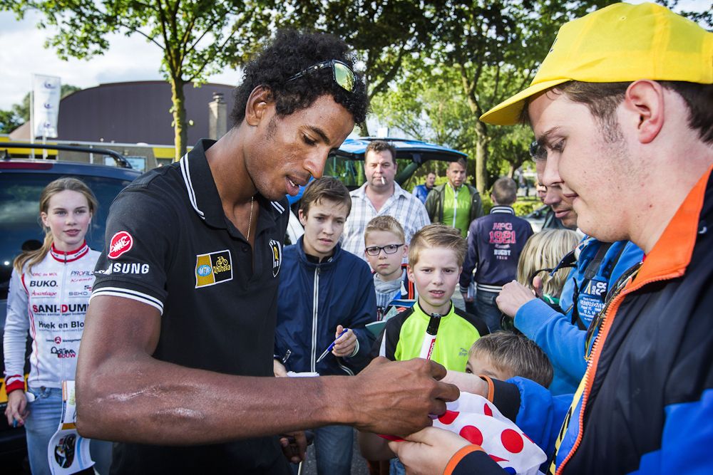 MTN-Qhubeka's Daniel Teklehaimanot signs autographs during 'Daags na de Tour,' in Boxmeer, the Netherlands, on July 27.