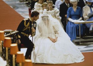 Princess Diana and Prince Charles sitting at the altar on their wedding day