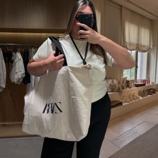 Photos of Who What Wear editor Ana Escalante trying on different Zara summer items in Zara Spain fitting room while visiting Madrid.