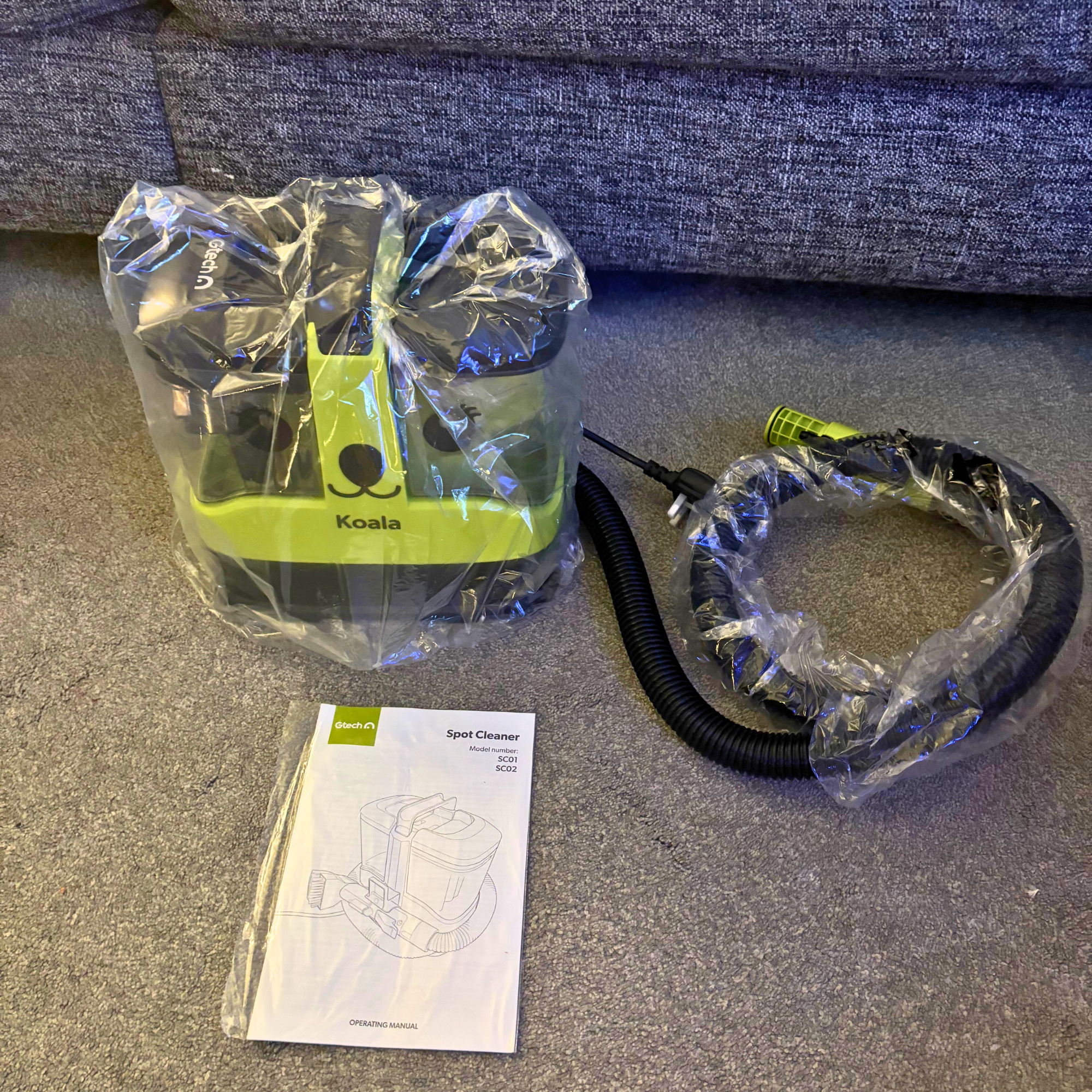 Gtech Koala Spot Cleaner and manual wrapped in plastic wrapping