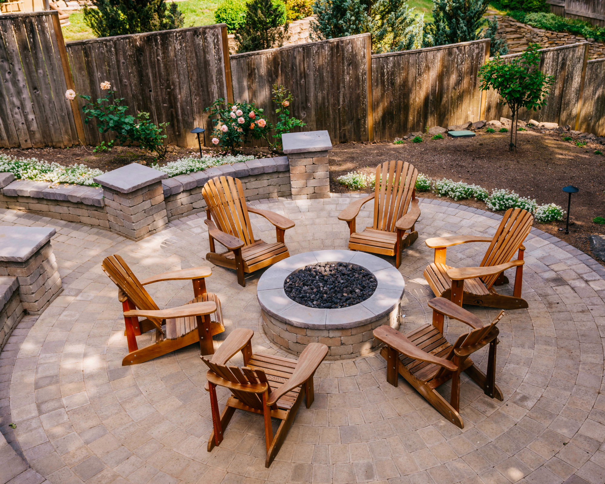 Patio with fire pit and Adirondack chairs