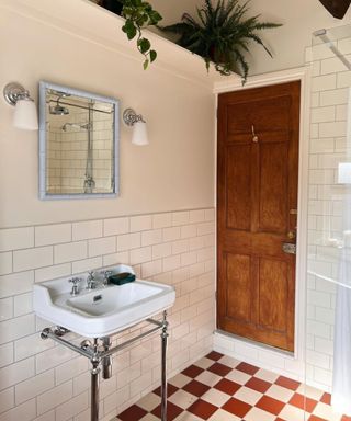 Bathroom with checkered floor and white sink