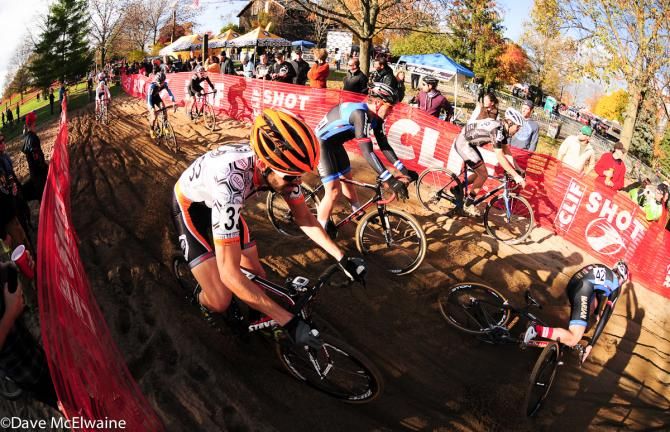 Riders attempt to avoid a crash in the sand pit