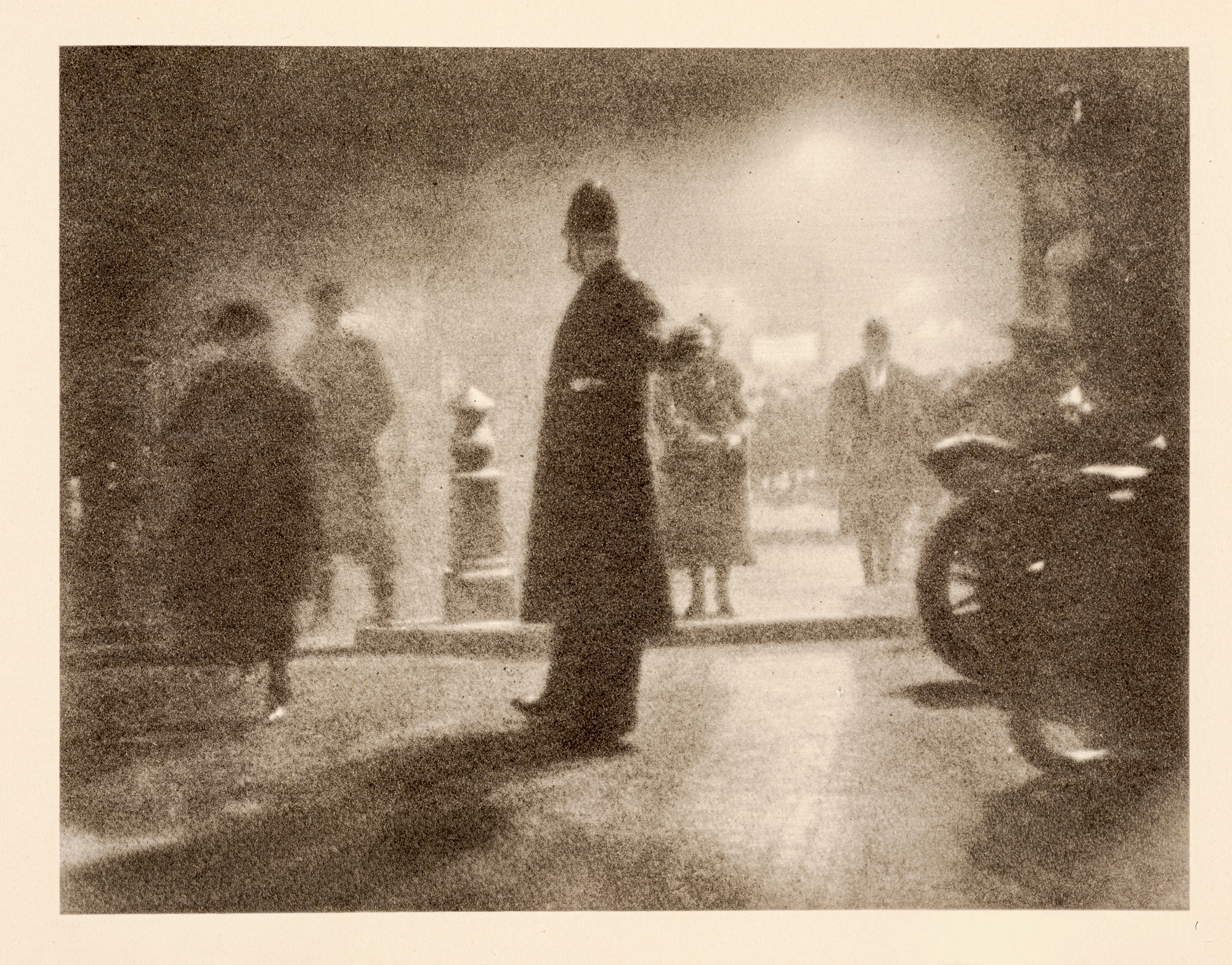 A dramatic photogravure of a helmeted policeman's silhouette standing in a misty London street at night, with pedestrians, a lamppost and the wheel of a parked vehicle visible around him.