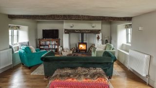 grey living room with inglenook stove fireplace