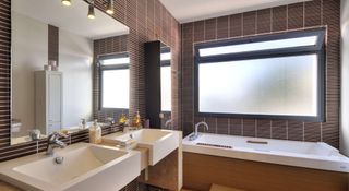 Luxury bathroom in brown tones