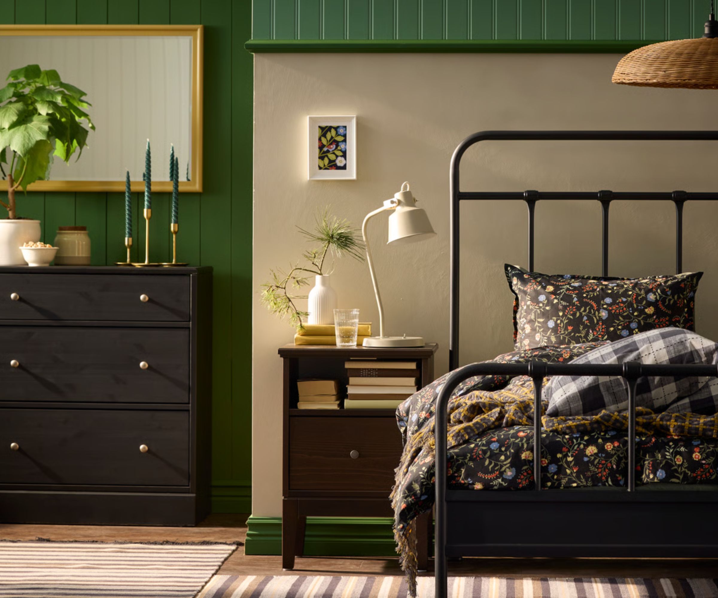 green ikea bedroom with a wrought iron bed frame
