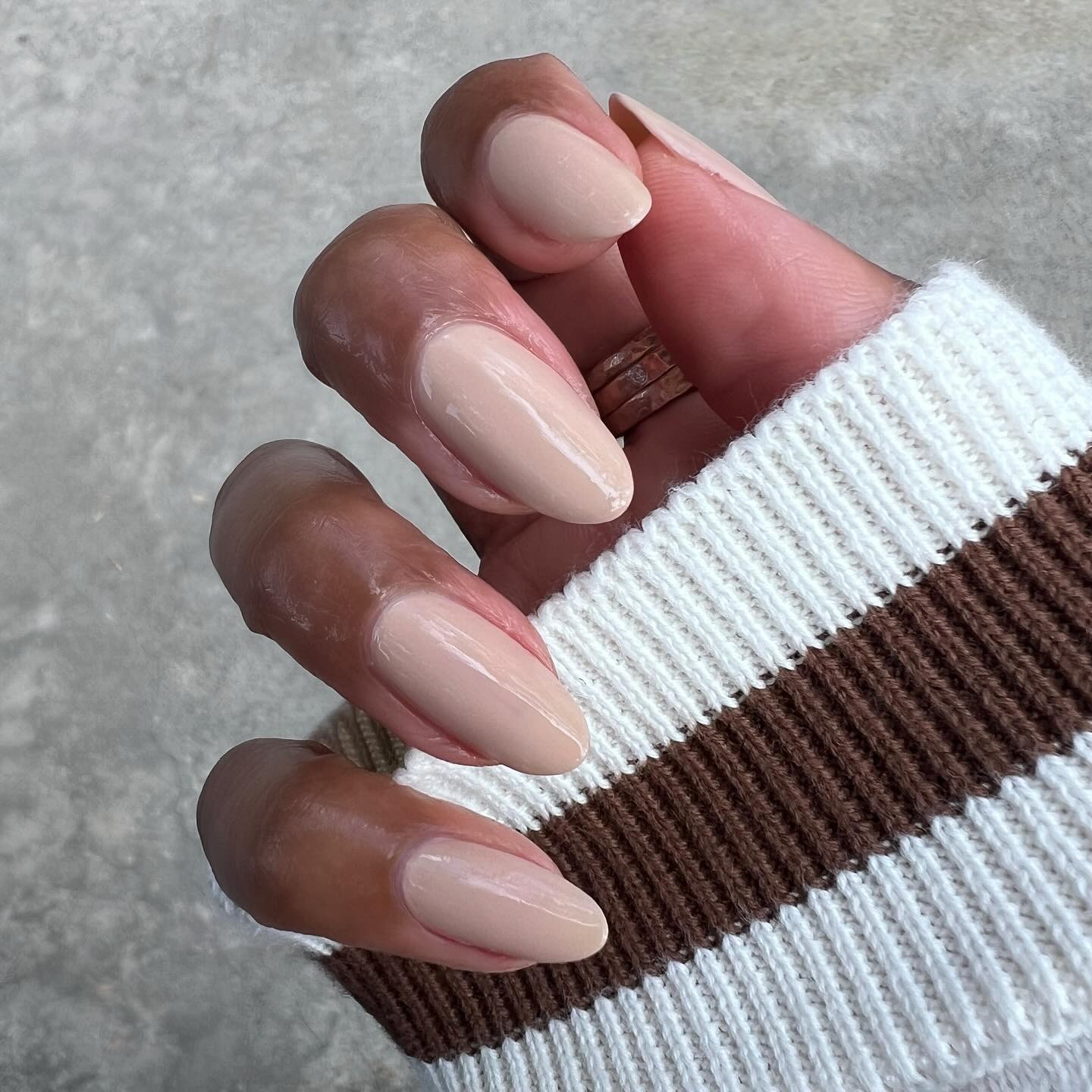 A close-up shot of a nude manicure