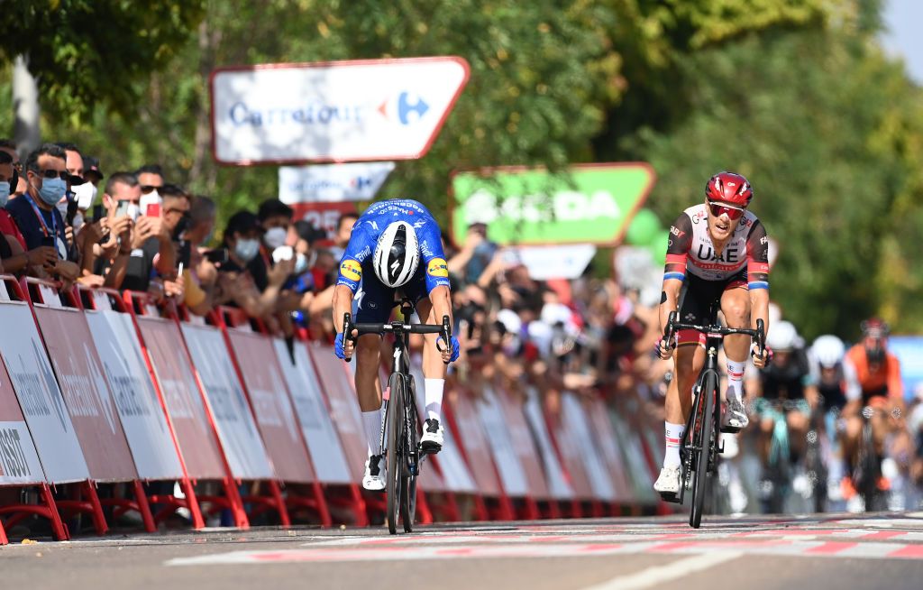 VILLANUEVA DE LA SERENA SPAIN AUGUST 27 LR Florian Senechal of France and Team Deceuninck QuickStep sprint to win ahead of Matteo Trentin of Italy and UAE Team Emirates during the 76th Tour of Spain 2021 Stage 13 a 2037km stage from Belmez to Villanueva de la Serena lavuelta LaVuelta21 on August 27 2021 in Villanueva de la Serena Spain Photo by Stuart FranklinGetty Images