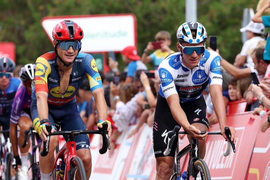 SCAR SPAIN SEPTEMBER 15 LR Kenny Elissonde of France and Team Lidl Trek and Remco Evenepoel of Belgium and Team Soudal Quick Step Polka dot Mountain Jersey cross the finish line during the 78th Tour of Spain 2023 Stage 19 a 1771km stage from La Baeza to scar UCIWT on September 15 2023 in scar Spain Photo by Alexander HassensteinGetty Images