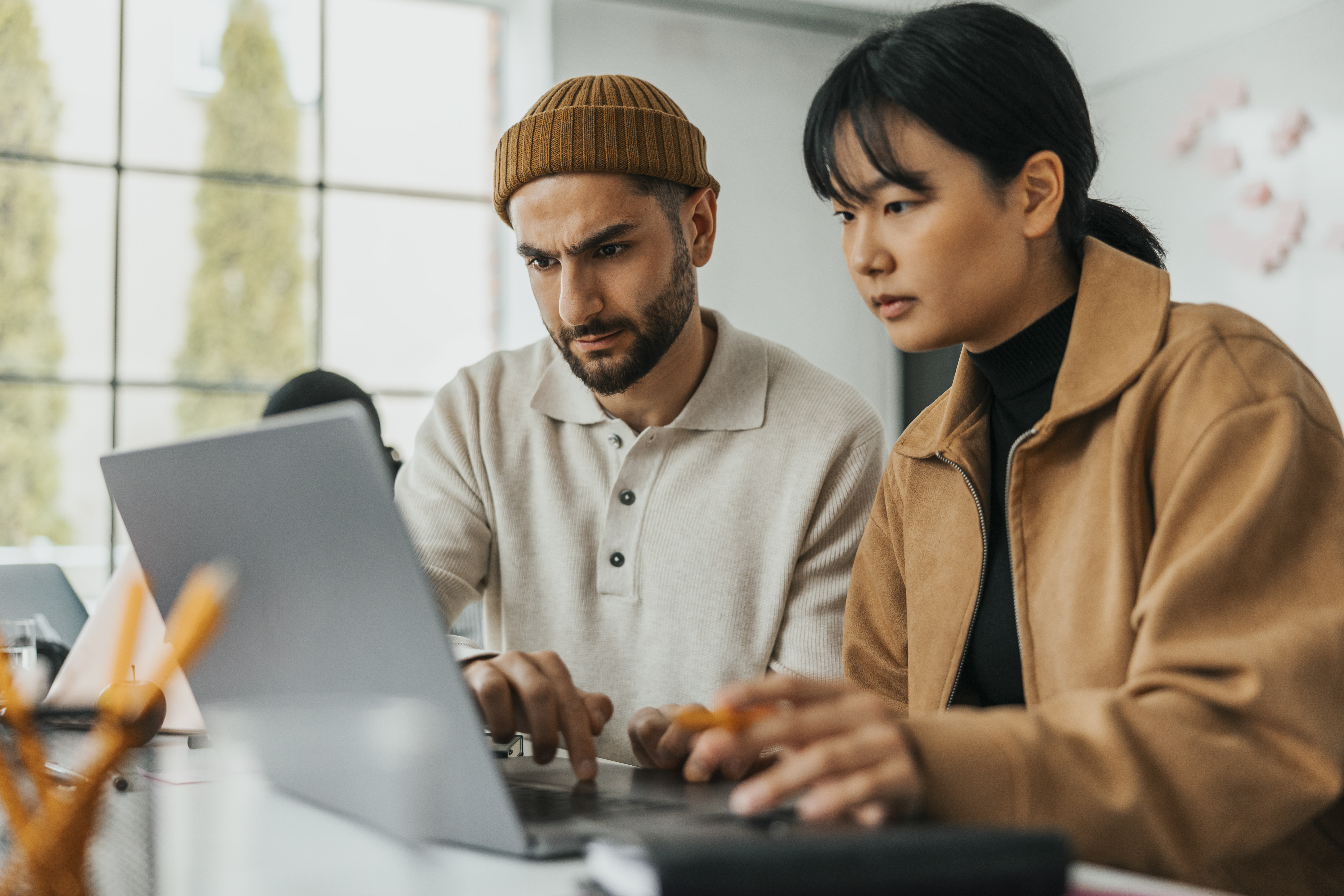 Couple look at finances on their laptop.