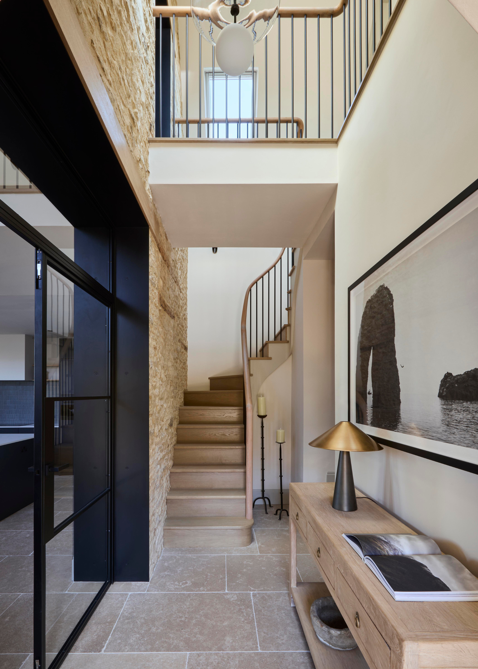 converted chapel entrance with double height staircase and modern fittings and accessories