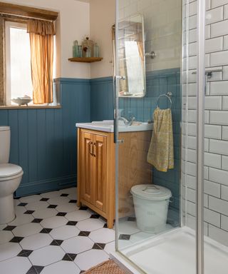 cottage bathroom with shower and wooden vanity unit