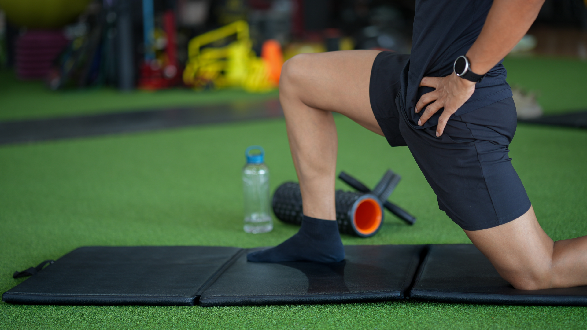 A man performing the couch stretch