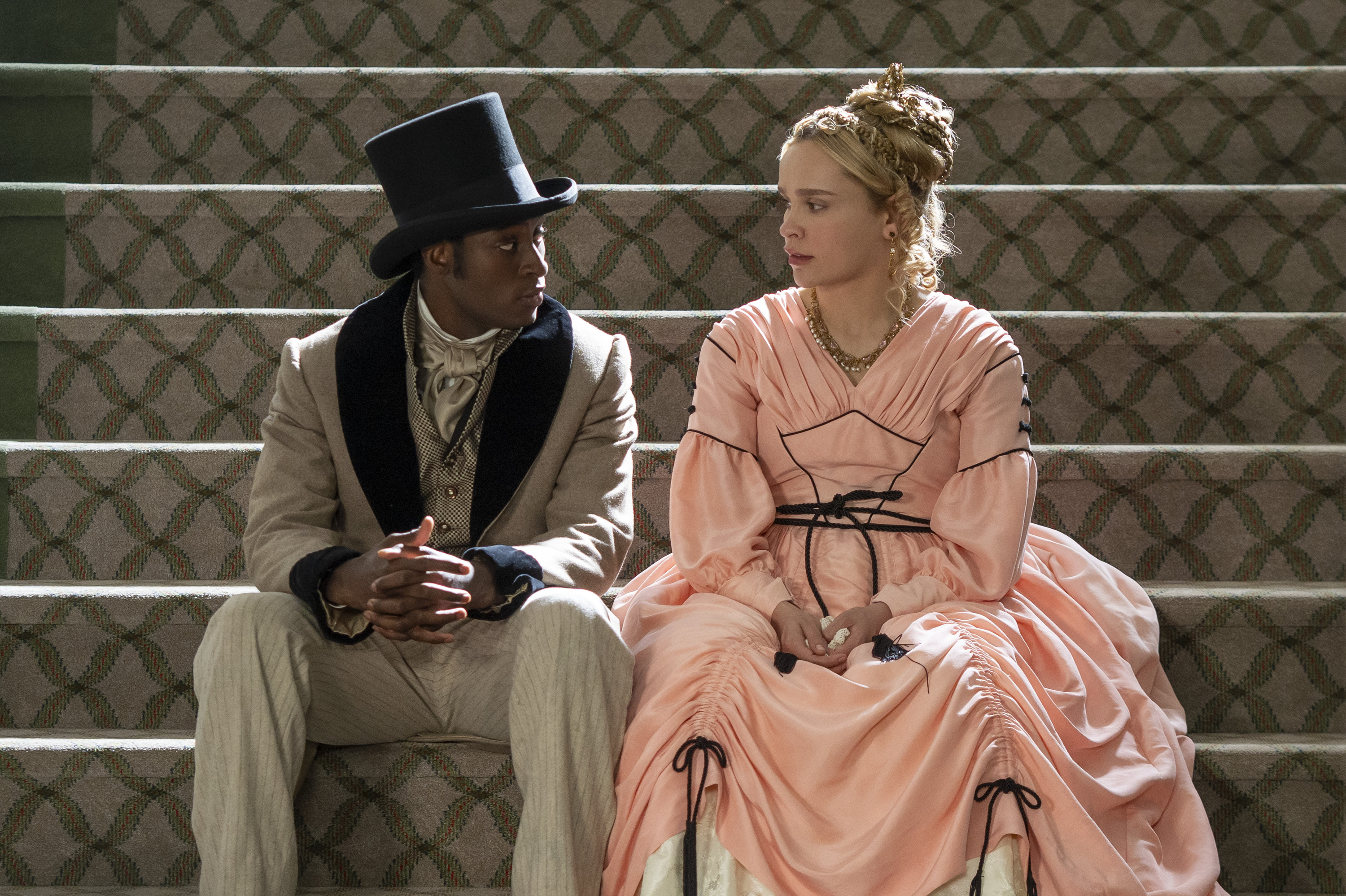 Ernest Kingsley Jr. as Wash and Iola Evans as Tanna, sitting on a large staircase, in 'Washington Black.'