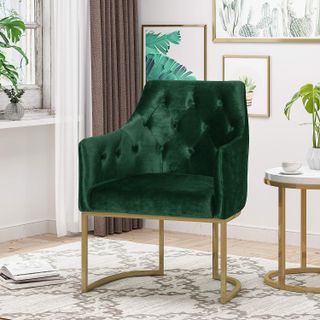 green velvet chair in a luxurious living room