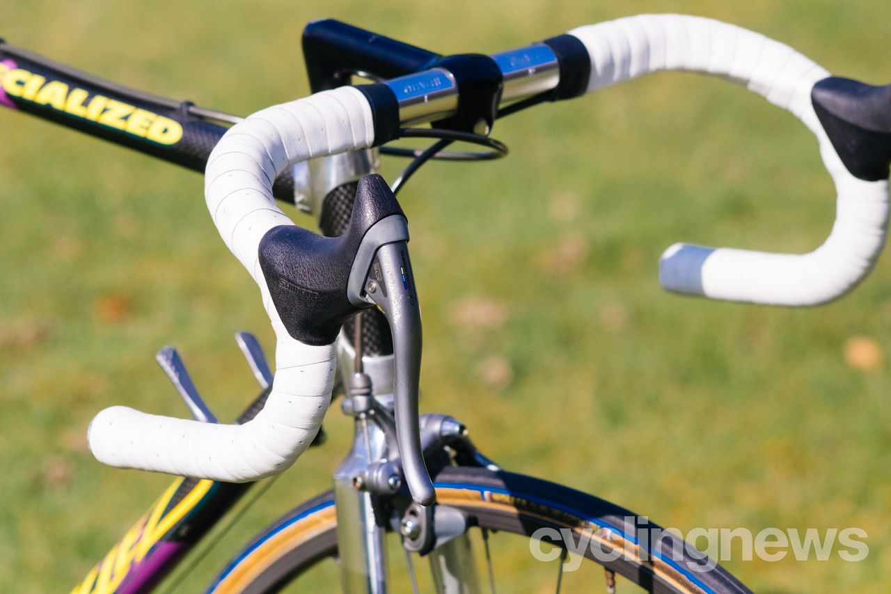 Close up of a shimano 600 brake lever on bars with white tape