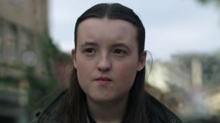 Ellie standing in Seattle looking out at TV station in The Last of Us Season 2 "Day One"