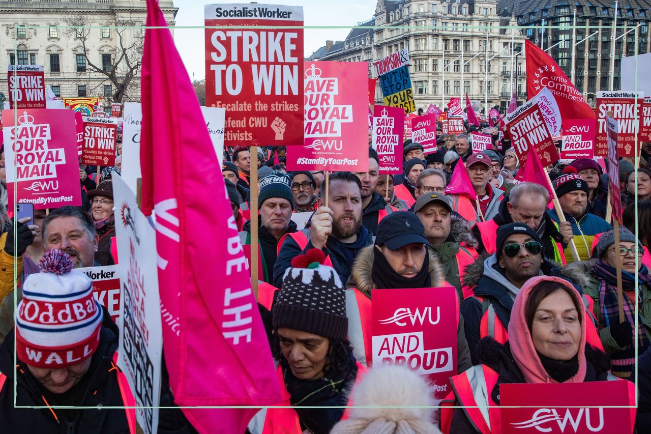 A crowd of Royal Mail workers on strike