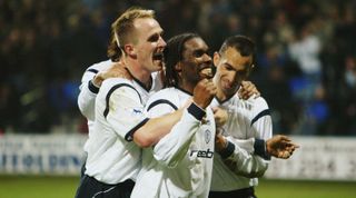 Jay Jay Okocha of Bolton Wanderers celebrates scoring the winning goal during the FA Barclaycard Premiership match between Bolton Wanderers and Tottenham Hotspur held on March 24, 2003 at the Reebok Stadium in Bolton, England