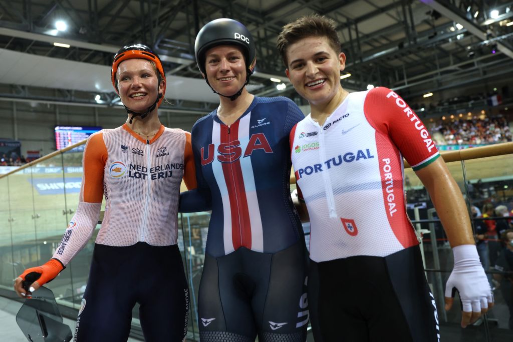 US Jennifer Valente C celebrates he victory after winning the Womens Omnium final point race 20km ahead of Netherlands Maike Van Der Duin L placing second and Portugals Maria Martins R placing third during the UCI Track Cycling World Championships at the Velodrome of SaintQuentinenYvelines southwest of Paris on October 14 2022 Photo by Thomas SAMSON AFP Photo by THOMAS SAMSONAFP via Getty Images