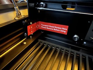 The Wecreat Vista laser cutter/engraver's shipping safety screws