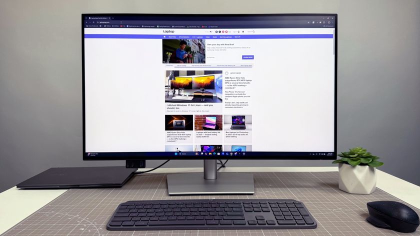 Dell UltraSharp 32 4K Thunderbolt Hub Monitor (U3225QE) on a white desk and gray background.