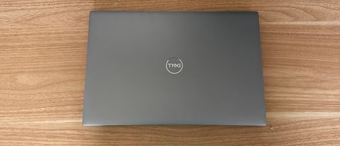 Dell Precision 5470 laptop closed on wooden table