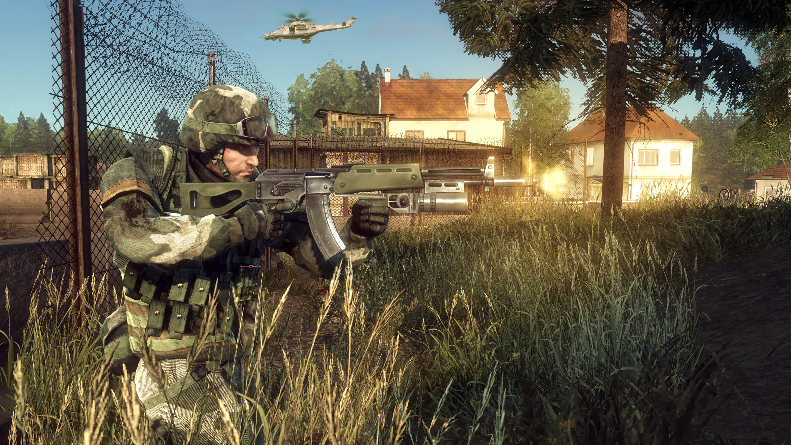 Battlefield Bad Company screenshot showing a soldier advancing and shooting their gun while a helicopter moves across the sky