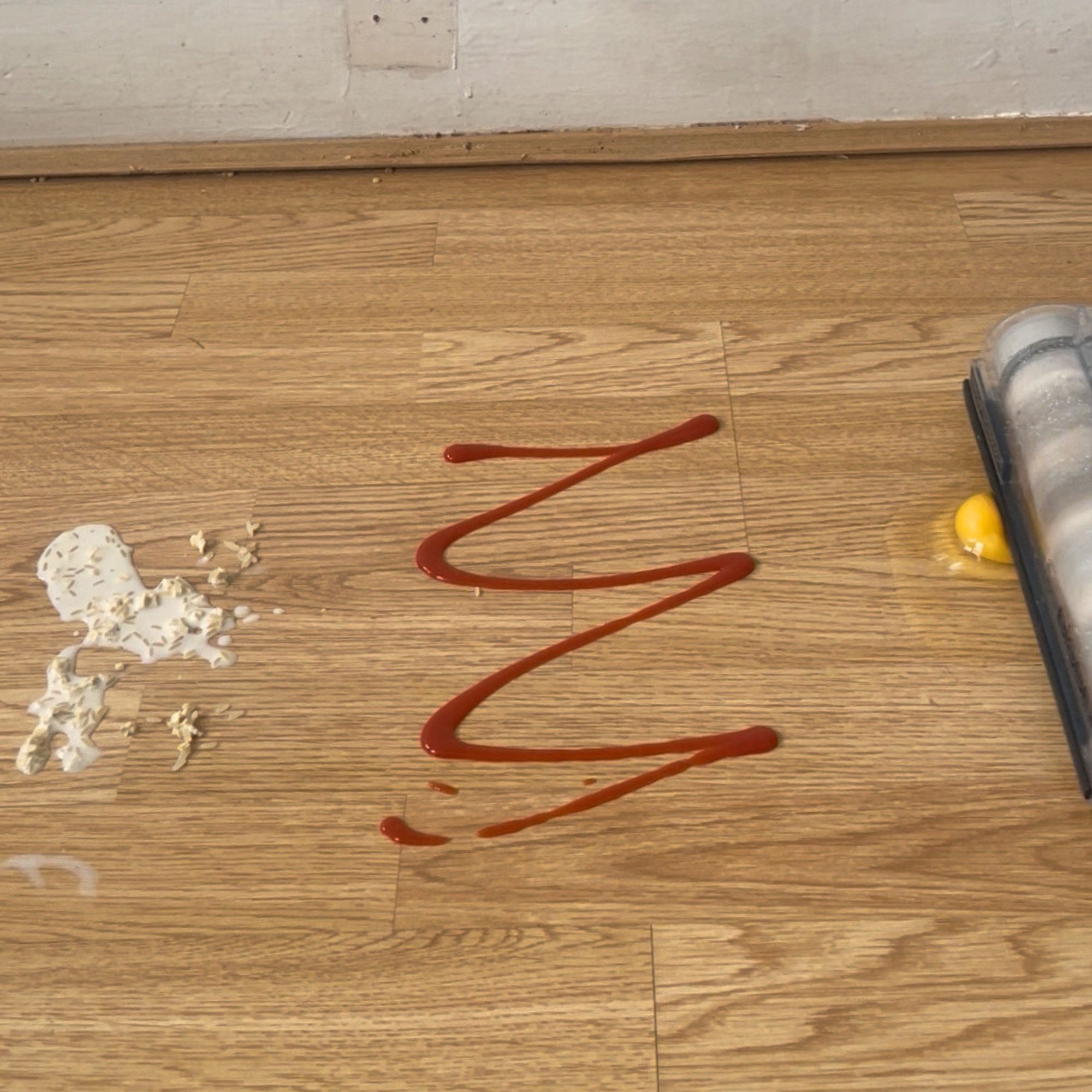 Laminate floor with food debris on it