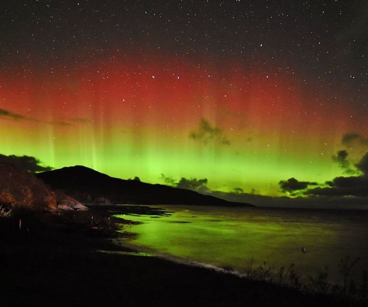 A view of the Aurora Borealis from a seaside plot in Scotland