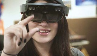 A student at William J. Palmer High School uses a mixed reality HoloLens.
