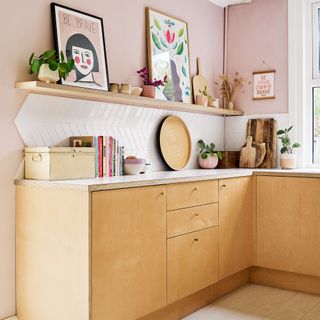 contemporary open plan kitchen diner space with plywood kitchen cabinetry