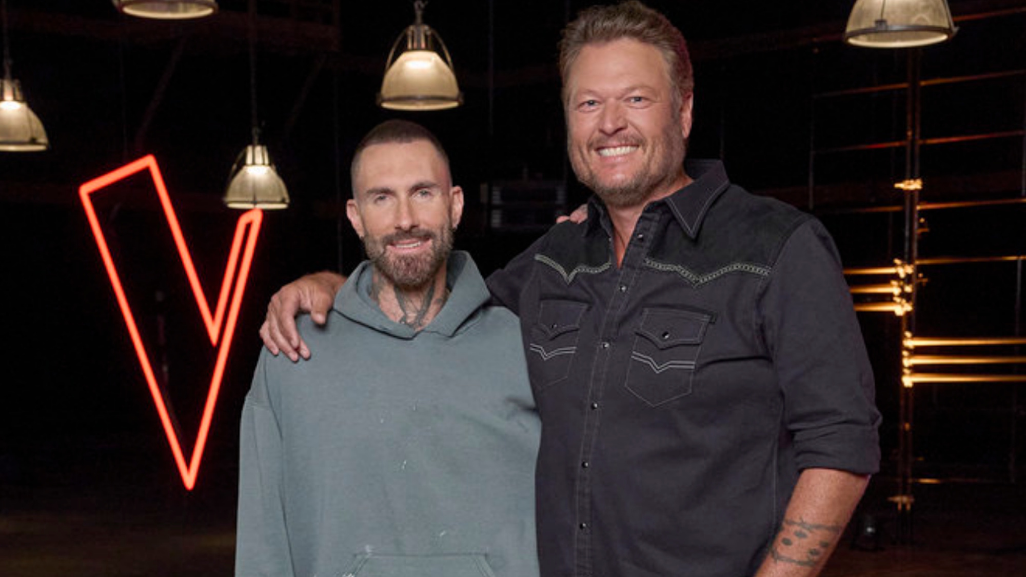 Adam Levine and Blake Shelton stand for a photo at The Voice 30th Season Celebration.